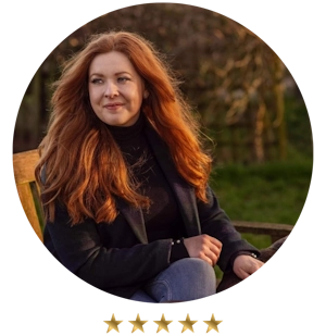 Shona sits outdoors on a bench, sporting a dark jacket and jeans, next to a golden star rating—reminiscent of the excellence seen in top small business consulting companies.